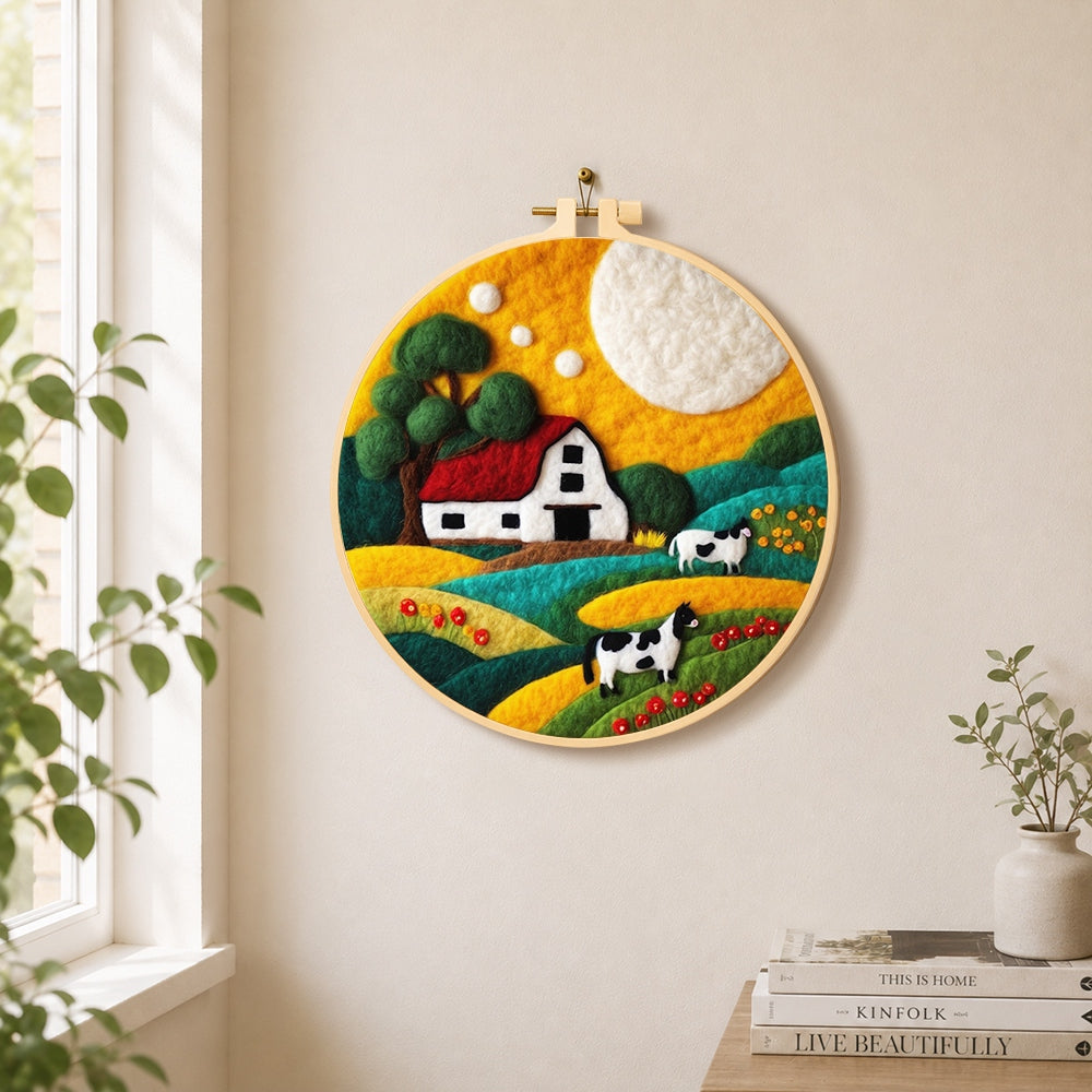 Cows and farm life needle felt wall art displayed in a bright home interior