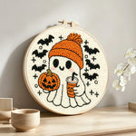 Cozy ghost with pumpkin spice latte punch needle artwork displayed on a table