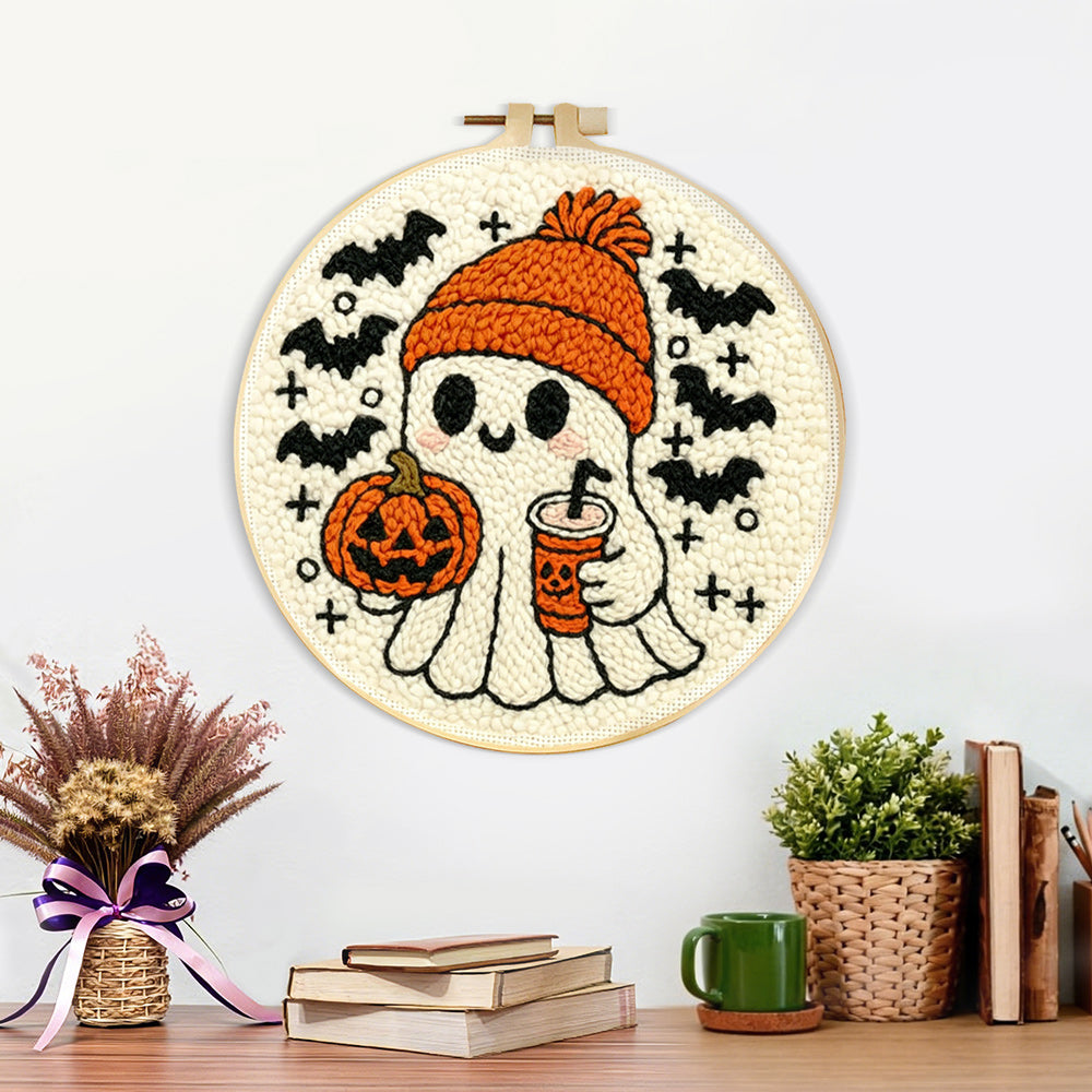 Finished cozy ghost with pumpkin spice latte artwork displayed on a wall