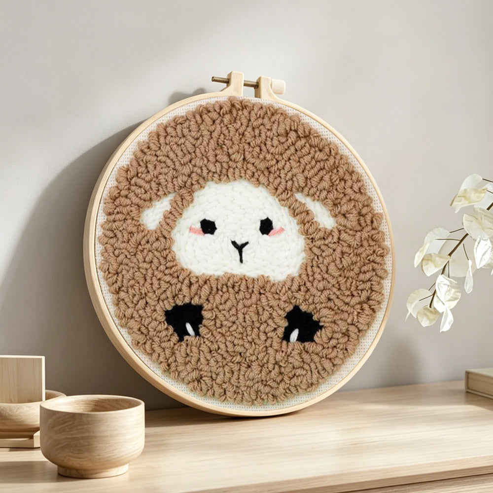Cozy sheep punch needle artwork displayed on a table