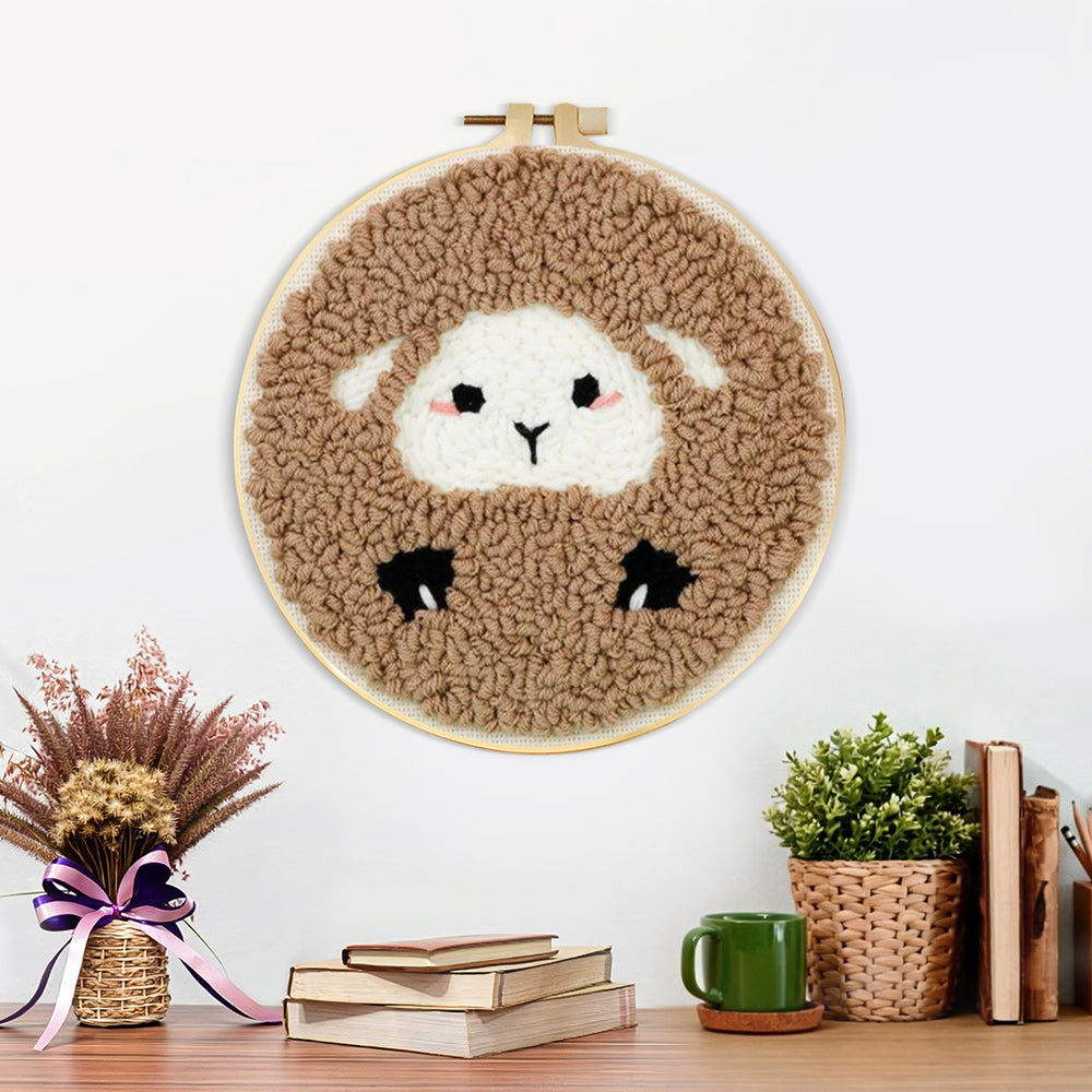 Finished cozy sheep artwork displayed on a wall