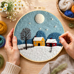Creating the cozy village on a snowy night wool painting by hand with a felting needle