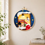 Cozy winter window needle felt wall art displayed in a bright home interior