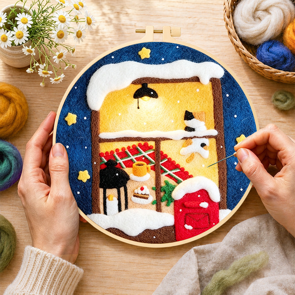 Creating the cozy winter window wool painting by hand with a felting needle