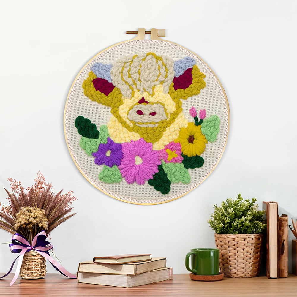 Finished cream floral highland cow artwork displayed on a wall