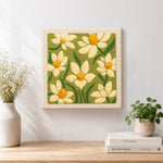 Finished creamy white daffodil artwork displayed on a wall