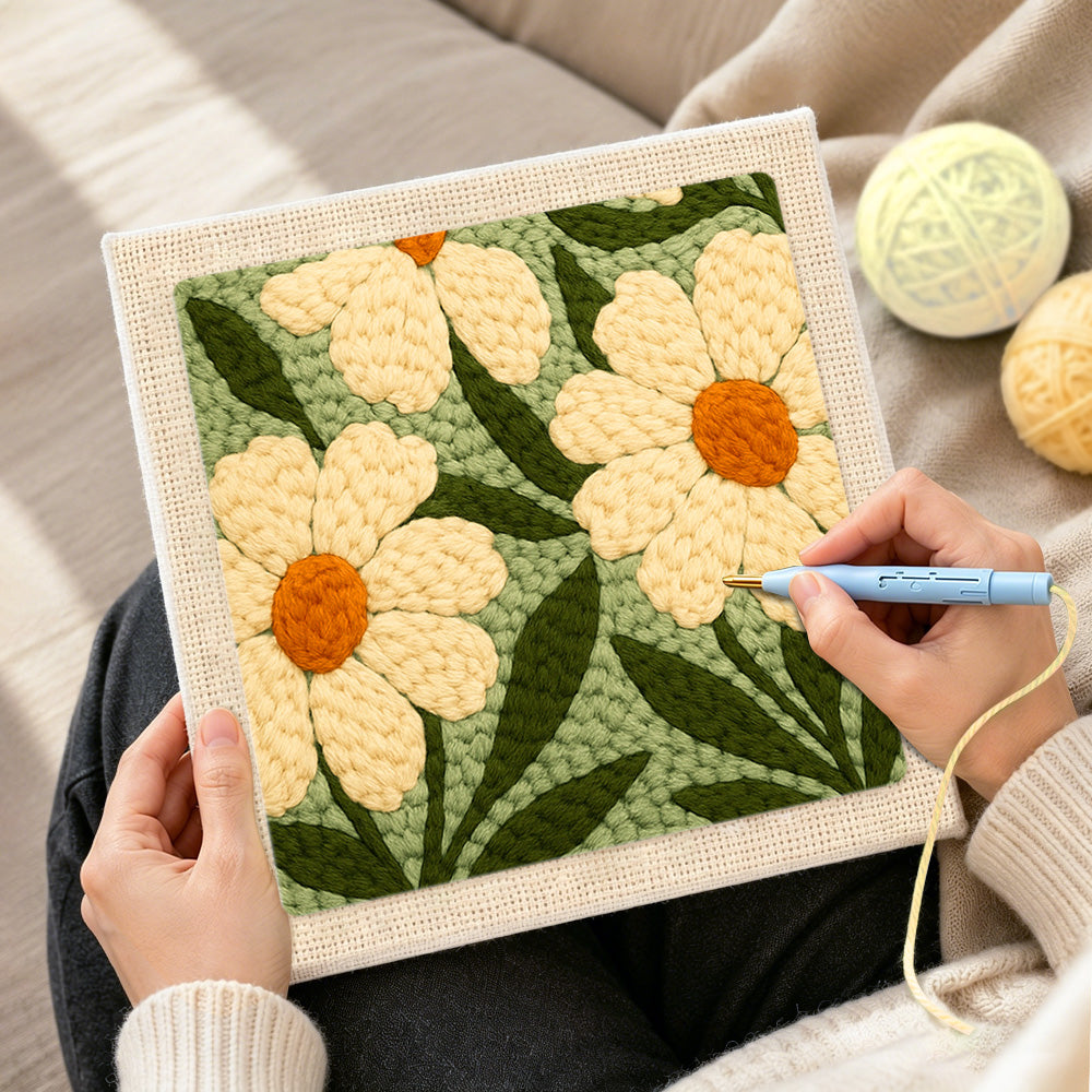 Creating handmade creamy white daisy flowers punch needle artwork