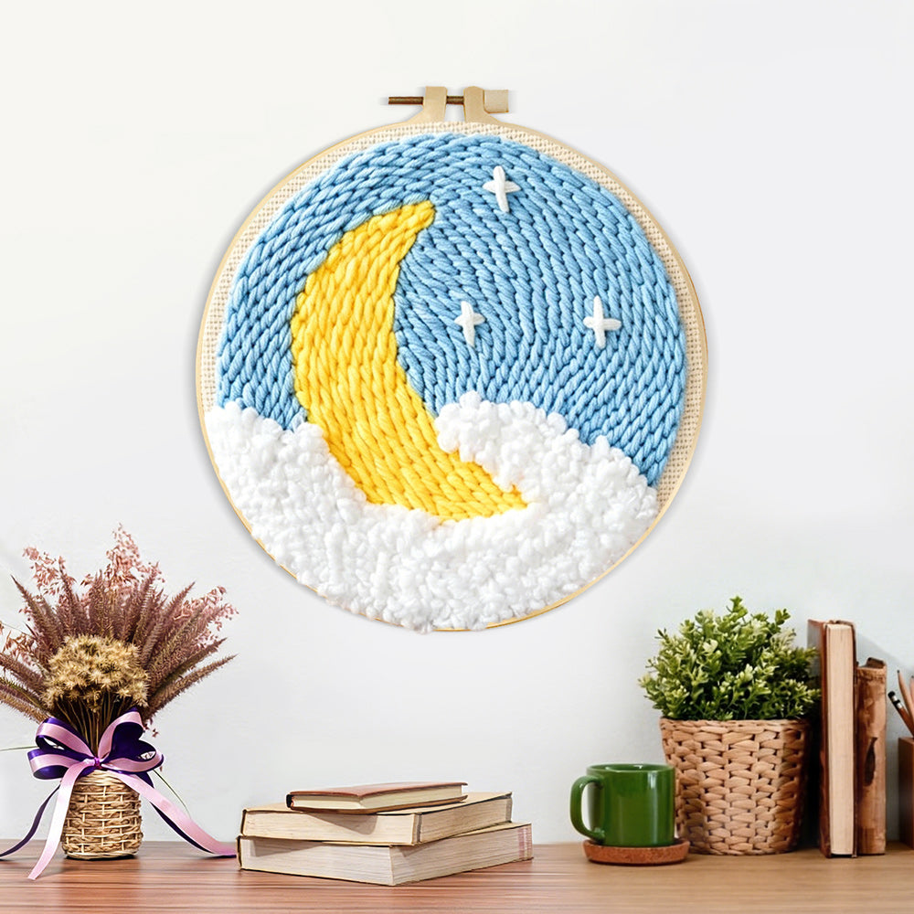 Finished crescent moon and stars artwork displayed on a wall