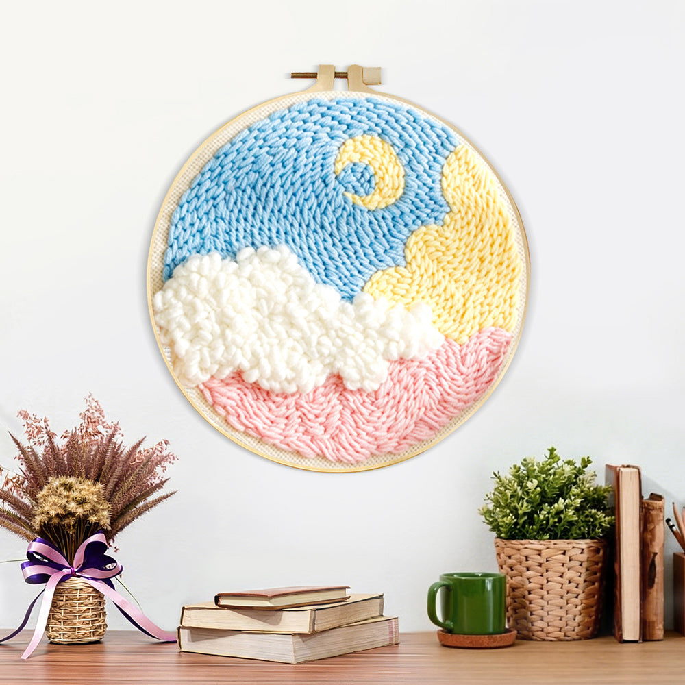 Finished crescent moon over colourful clouds artwork displayed on a wall
