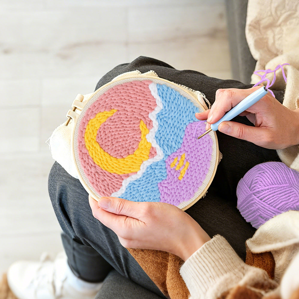 Creating handmade crescent moon over mountain and sea punch needle artwork