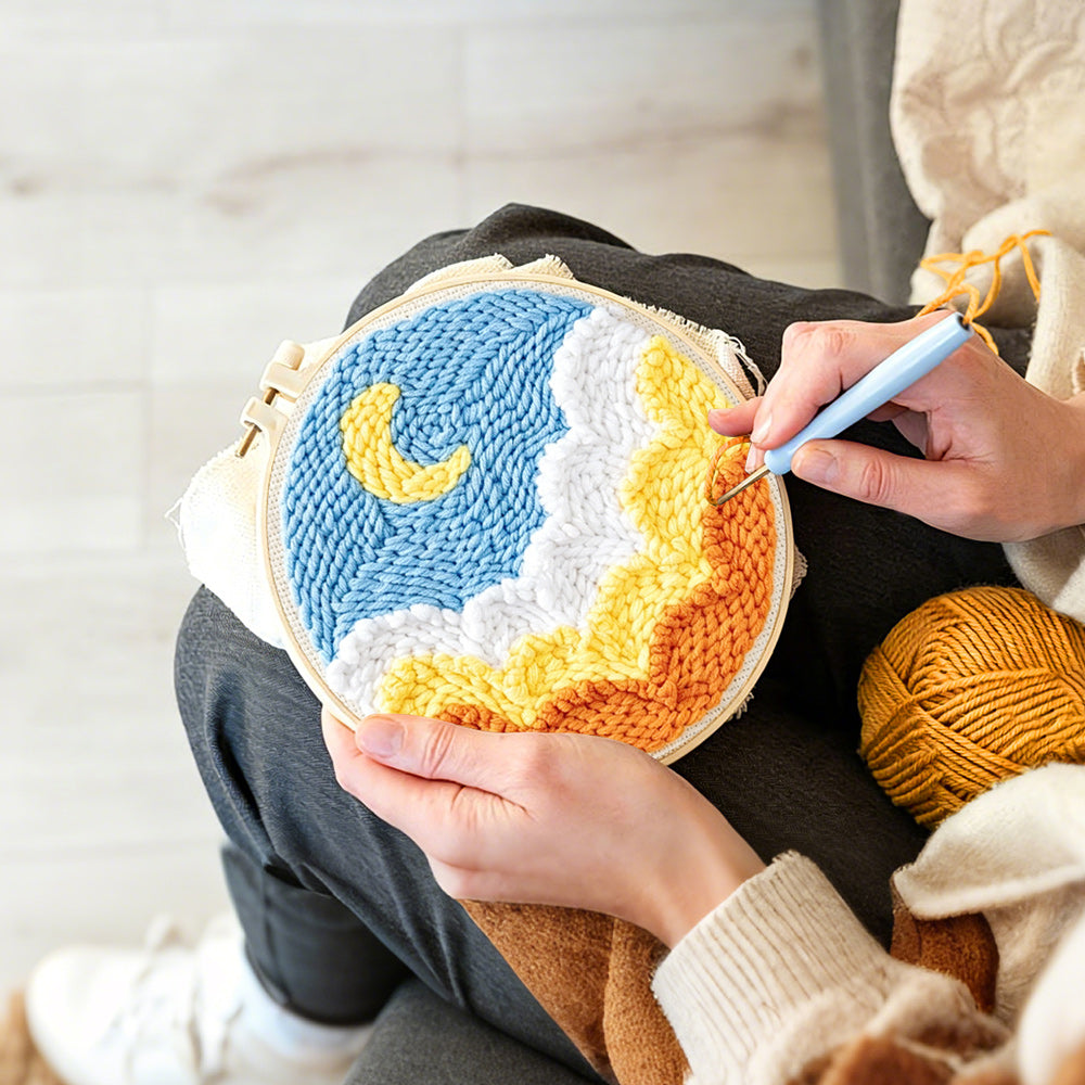 Creating handmade crescent moon over ocean waves punch needle artwork