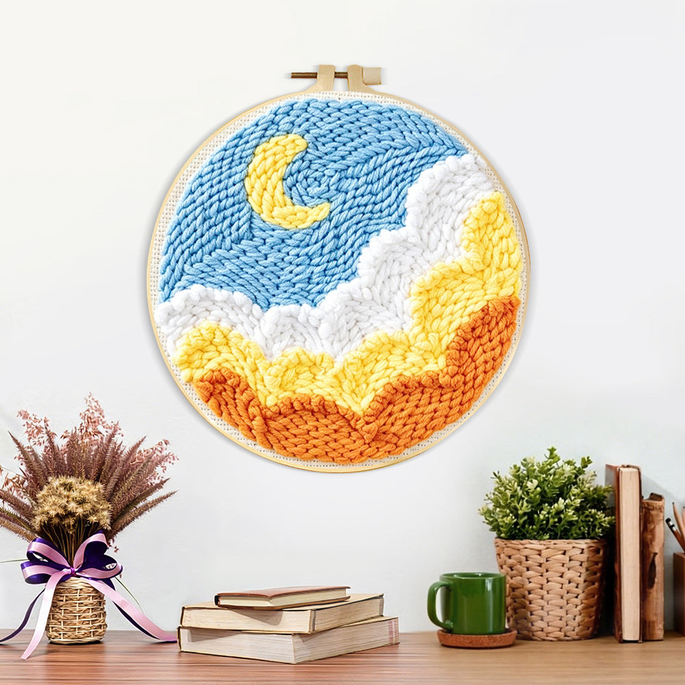 Finished crescent moon over ocean waves artwork displayed on a wall