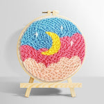 Crescent moon over pink and blue cloud sky punch needle kit for beginners