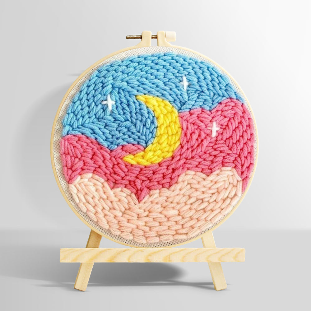 Crescent moon over pink and blue cloud sky punch needle kit for beginners