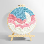 Crescent moon over pink and white clouds punch needle kit for beginners