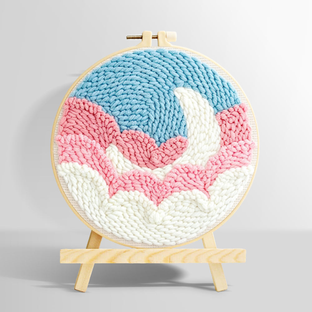 Crescent moon over pink and white clouds punch needle kit for beginners