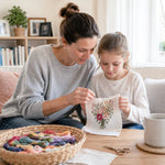 Family enjoying creative time with a cross stitch embroidery kit at home