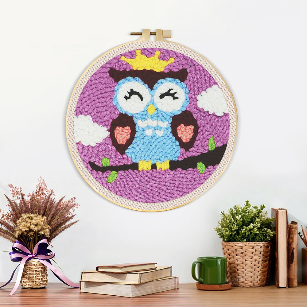 Finished crowned owl artwork displayed on a wall