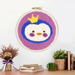 Finished crowned princess penguin artwork displayed on a wall