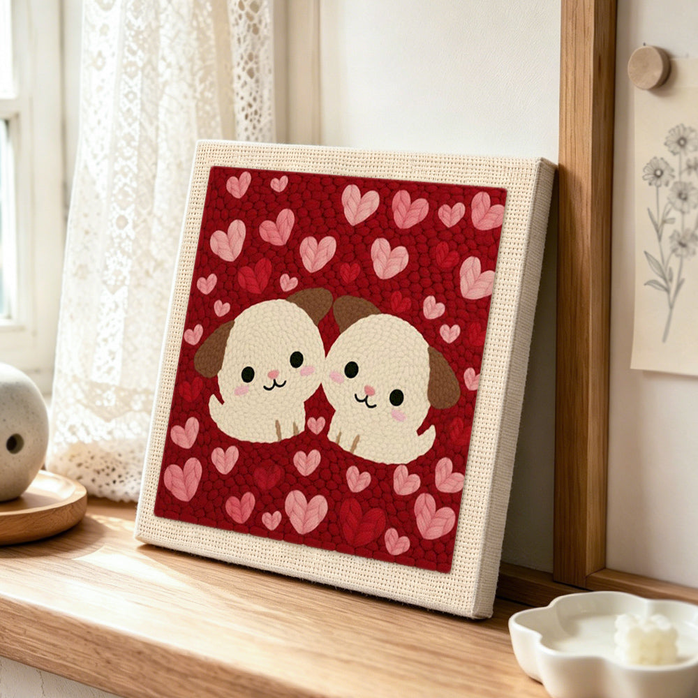 Cuddling puppy duo punch needle artwork displayed on a table