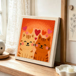 Cuddling tabby cat couple punch needle artwork displayed on a table
