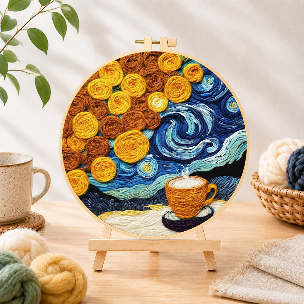 Finished cup of coffee under a swirling starry sky needle felting displayed on a wooden easel