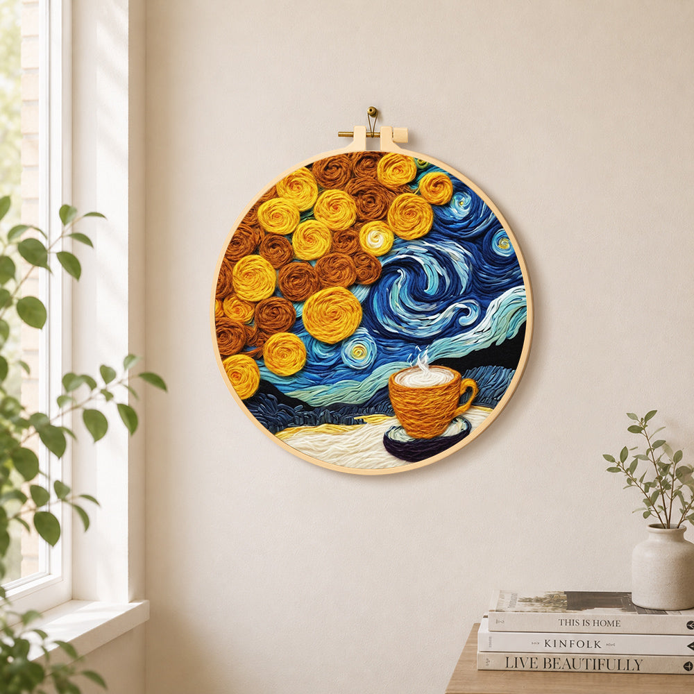 Cup of coffee under a swirling starry sky needle felt wall art displayed in a bright home interior