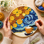 Creating the cup of coffee under a swirling starry sky wool painting by hand with a felting needle