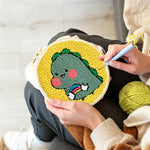 Creating handmade cute baby dinosaur punch needle artwork