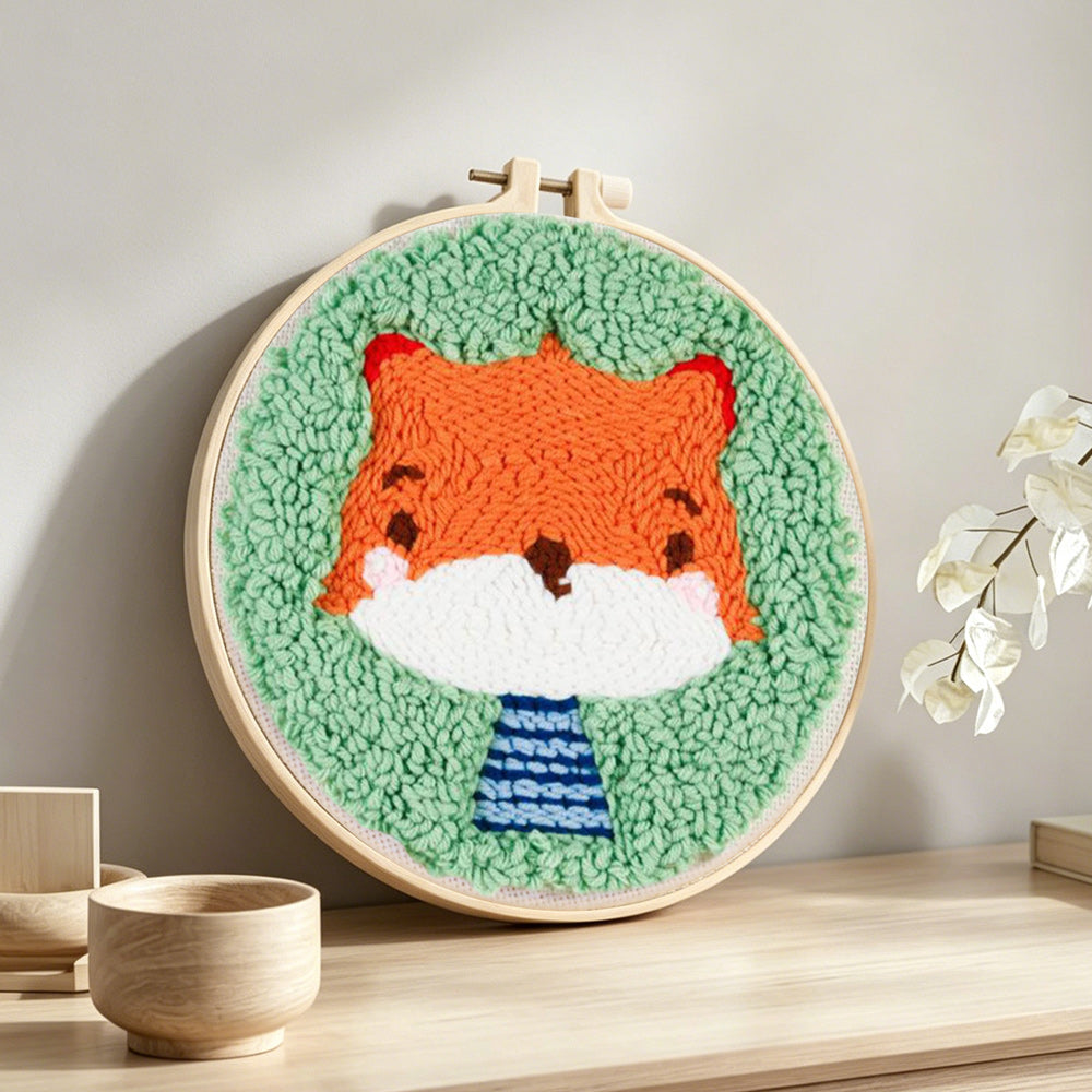 Cute baby fox punch needle artwork displayed on a table