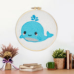 Finished cute baby whale artwork displayed on a wall