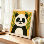 Cute bamboo panda punch needle artwork displayed on a table
