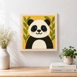 Finished cute bamboo panda artwork displayed on a wall