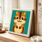 Cute big-eyed chipmunk punch needle artwork displayed on a table