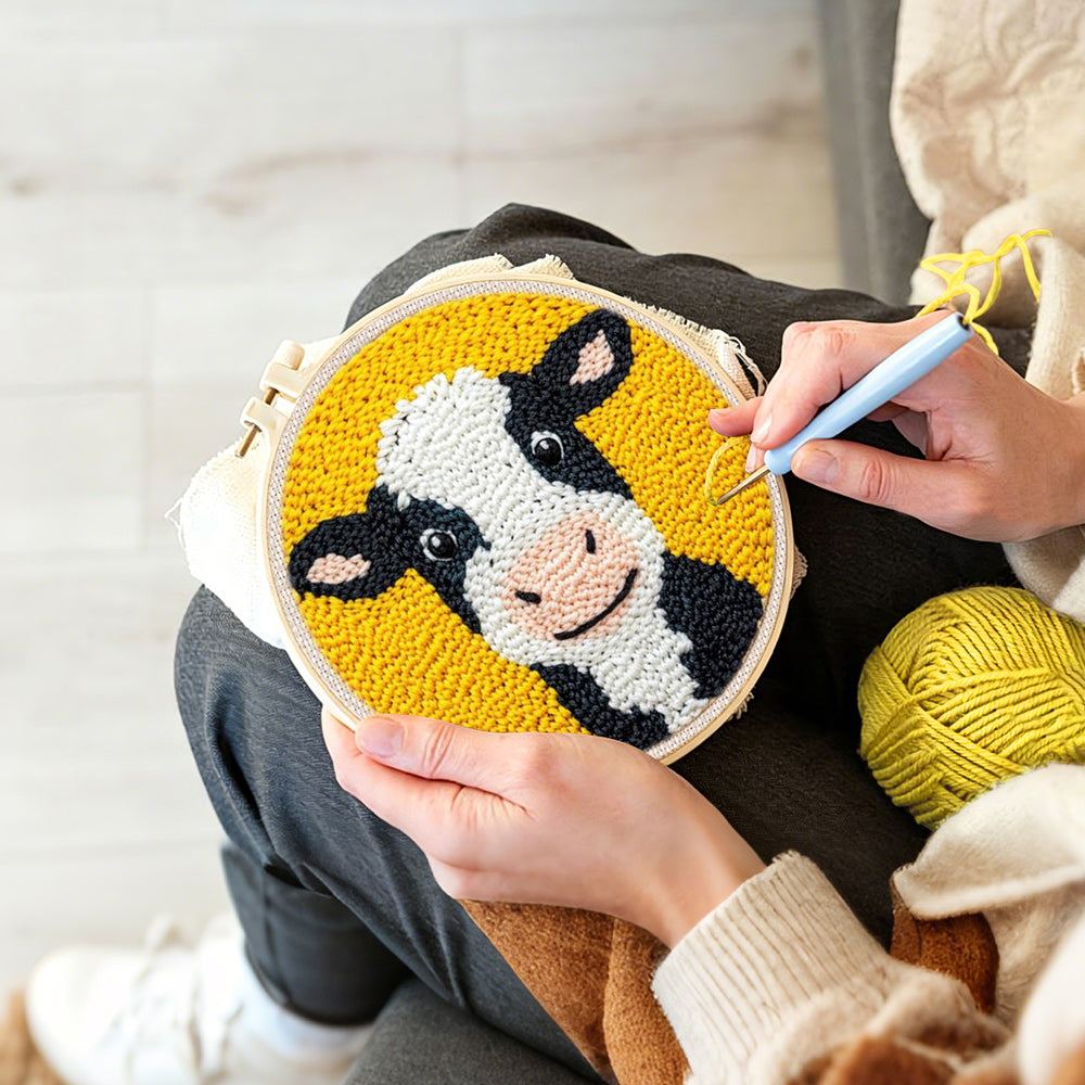 Creating handmade cute black and white cow punch needle artwork