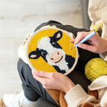 Creating handmade cute black and white cow punch needle artwork