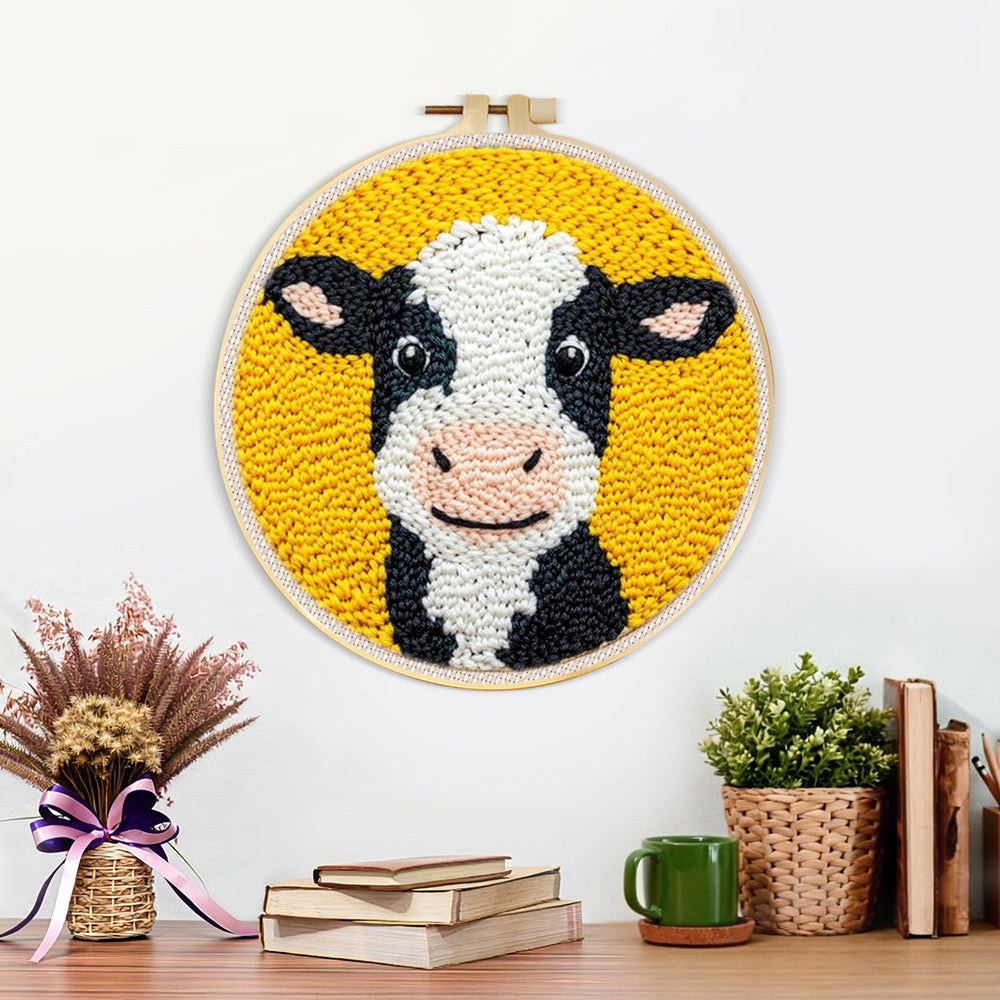 Finished cute black and white cow artwork displayed on a wall