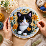 Creating the cute black and white kitten wool painting by hand with a felting needle