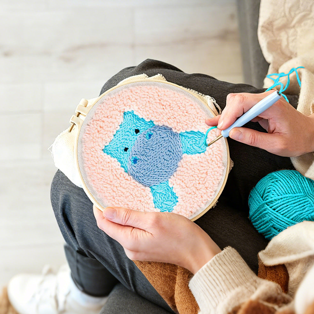 Creating handmade cute blue hippo punch needle artwork