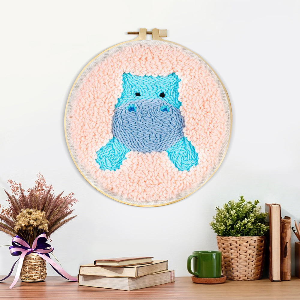 Finished cute blue hippo artwork displayed on a wall