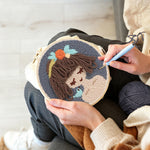 Creating handmade cute brown haired girl punch needle artwork