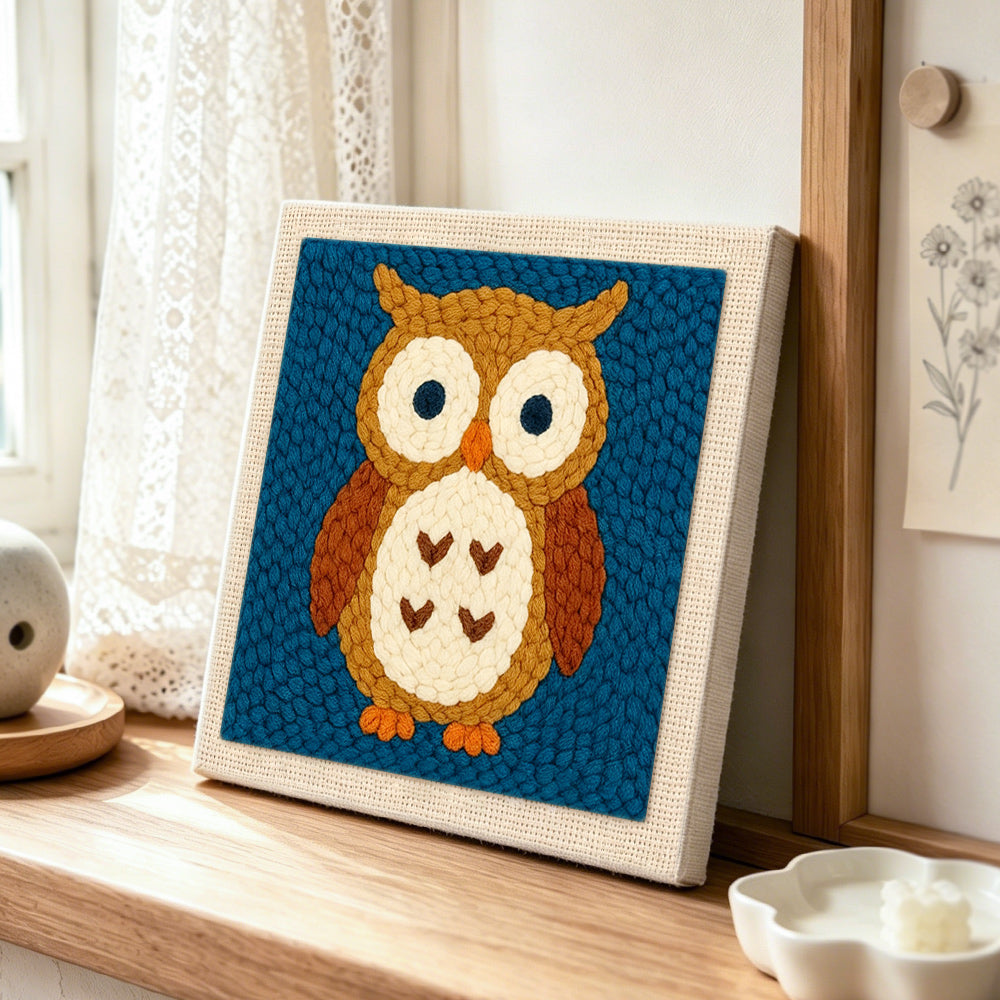 Cute brown owl punch needle artwork displayed on a table
