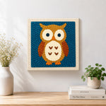 Finished cute brown owl artwork displayed on a wall