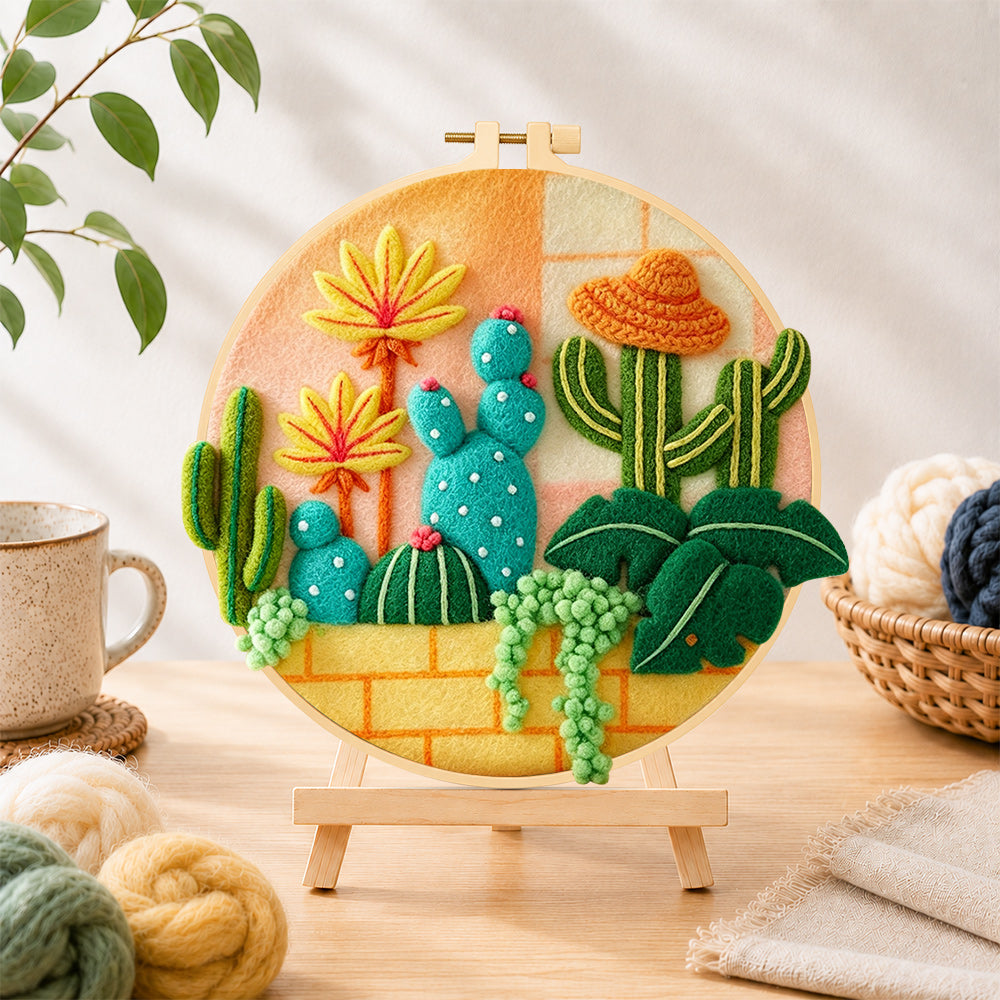 Finished cute cacti with sombrero hat needle felting displayed on a wooden easel