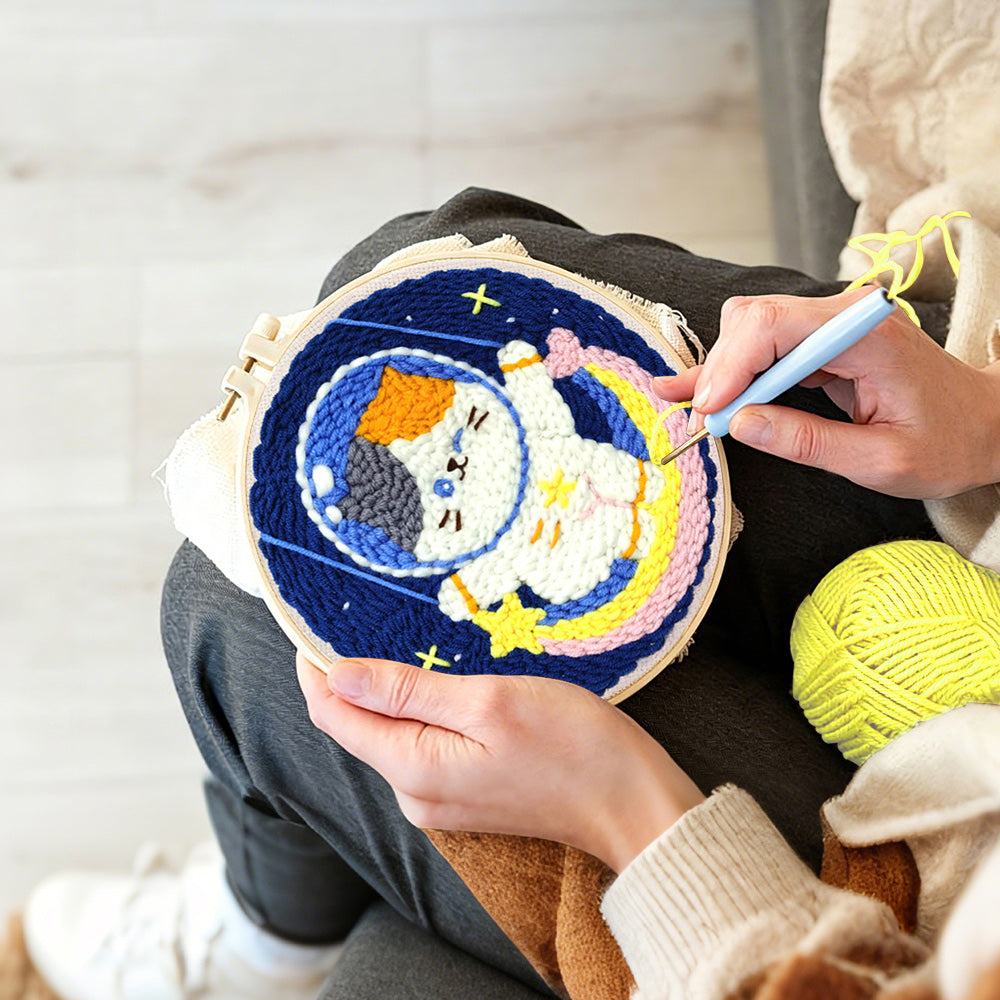 Creating handmade cute calico cat astronaut on rainbow moon punch needle artwork