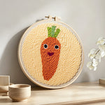 Cute carrot punch needle artwork displayed on a table