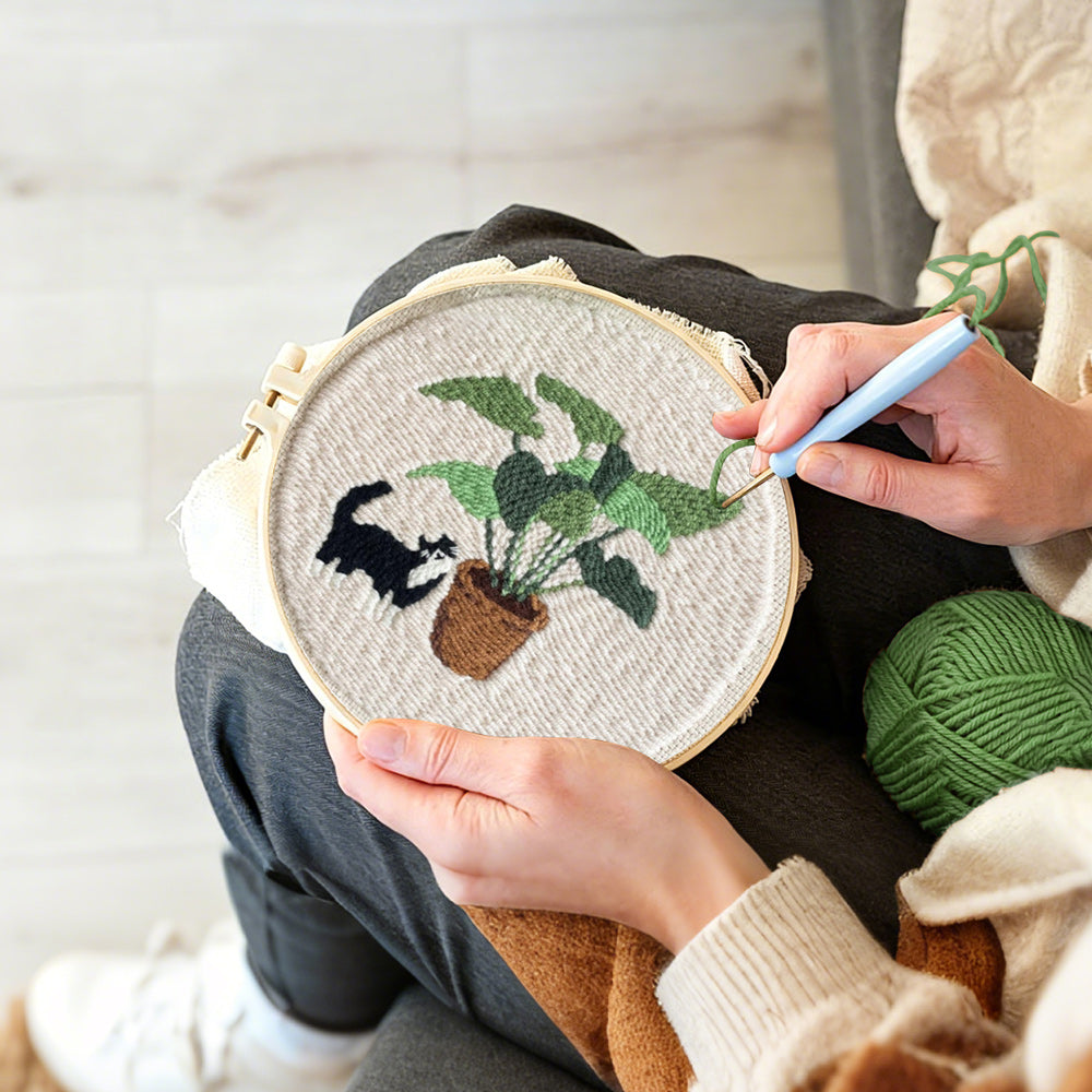 Creating handmade cute cat by houseplant punch needle artwork