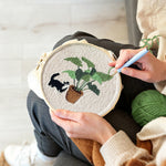 Creating handmade cute cat by houseplant punch needle artwork