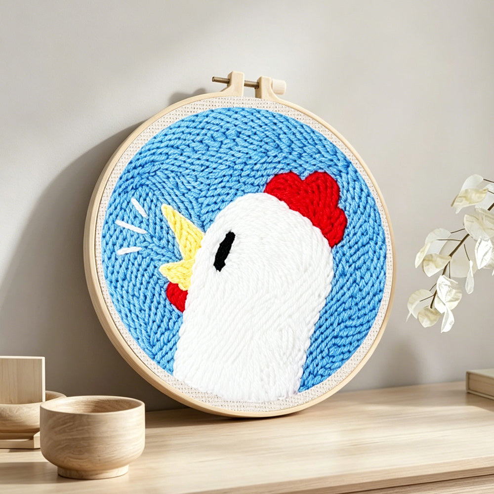 Cute chicken head punch needle artwork displayed on a table
