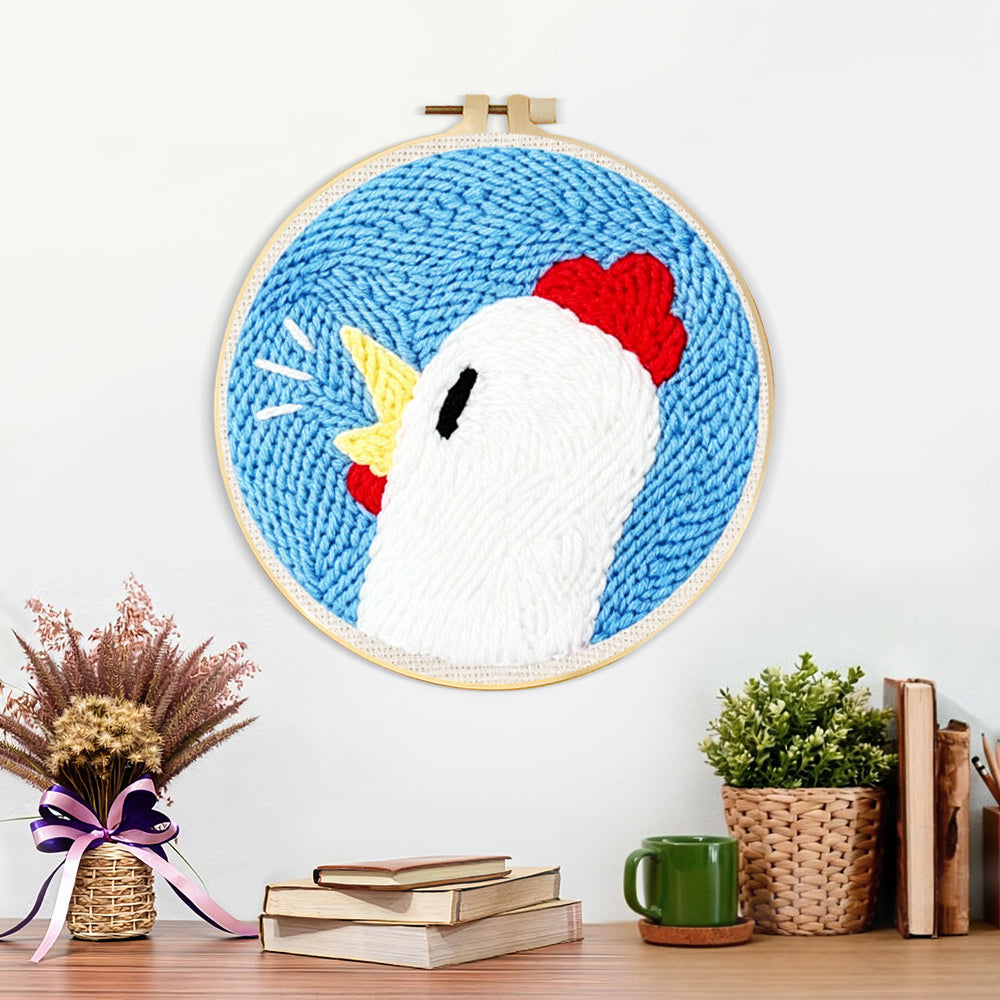 Finished cute chicken head artwork displayed on a wall